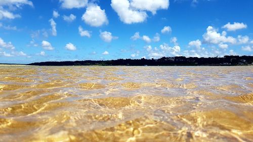 Scenic view of sea against blue sky