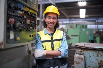 Portrait of engineer standing in factory