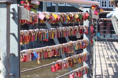 Close-up of padlocks hanging on railing