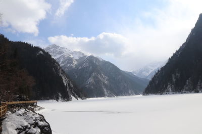 Scenic view of snowcapped mountains against sky