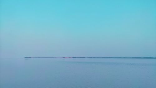 Scenic scenic view of sea against clear blue sky