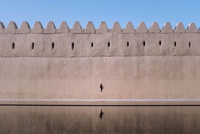 Low angle view of museum against clear blue sky