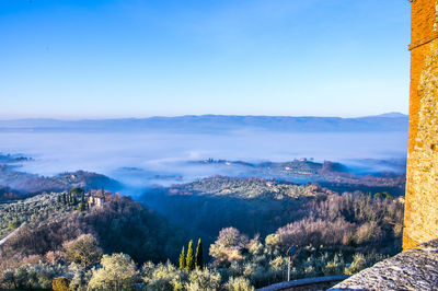 Scenic view of mountains against clear blue sky