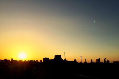 Silhouette of buildings at sunset