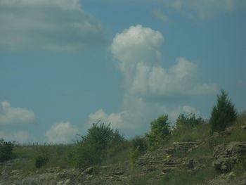 Scenic view of landscape against cloudy sky