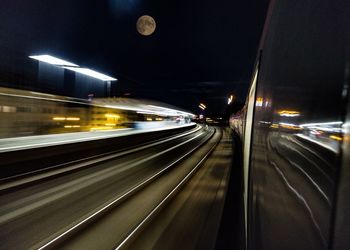 Blurred motion of car on road at night