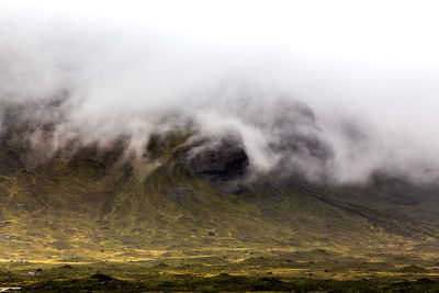 Scenic view of volcanic mountain against sky