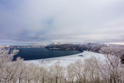 Scenic view of sea against sky during winter