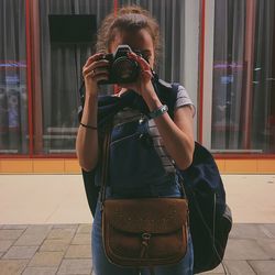 Woman photographing with camera