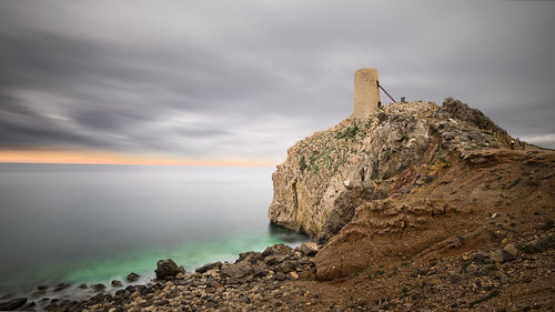 Scenic view of sea against sky at sunset