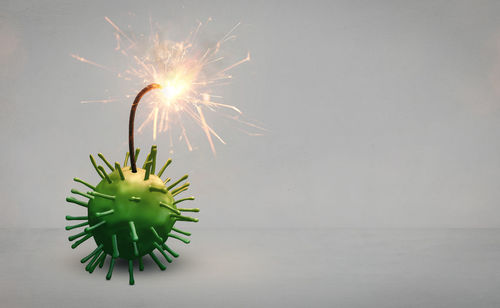 Close-up of firework display against wall