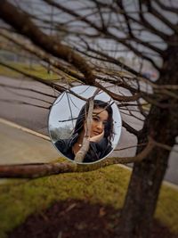 Portrait of a girl with tree trunk