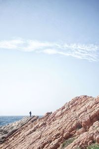 Scenic view of sea and mountains against sky
