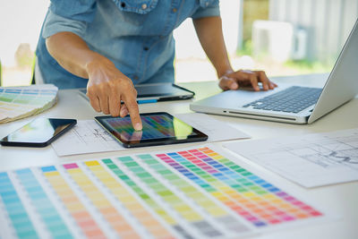 Low section of person working on table