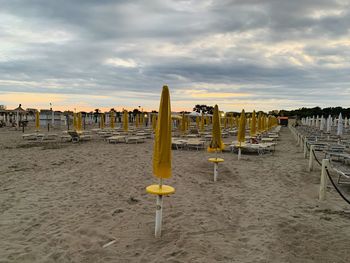 Scenic view of beach against sky during sunset