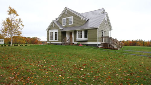 House on field against sky