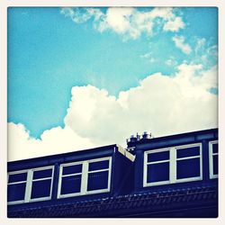 Low angle view of building against blue sky