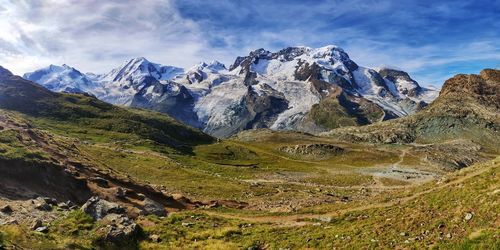 Scenic view of snowcapped mountains against sky