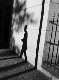 Full length of woman standing on railing