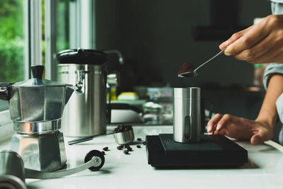 Cropped hand of man working on table