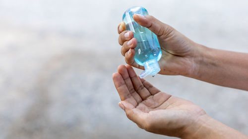 Close-up of hands holding water