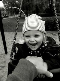 Portrait of cute girl on swing