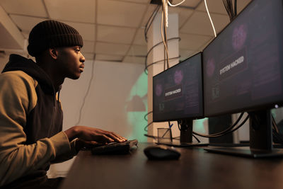 Portrait of young man working at office