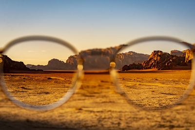 View at the wadi rum desert in jordan through glasses during a nice sunset with clear sky. 