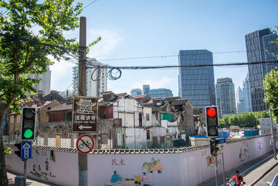 City street and buildings against sky