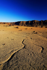 Rocks at el teide national park against clear blue sky