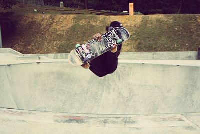 Man skateboarding in mid-air