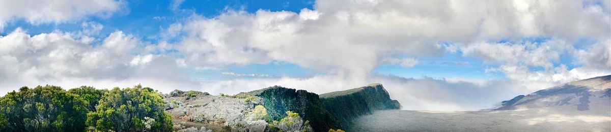 Panoramic view of waterfall against sky