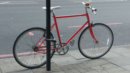 Bicycle parked on road