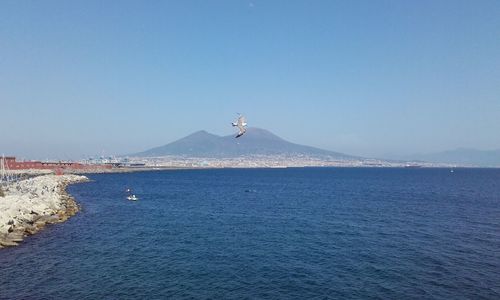 Scenic view of sea against clear blue sky