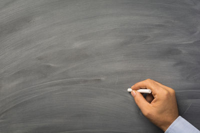 High angle view of person hand holding paper