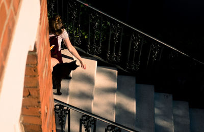 High angle view of woman on staircase