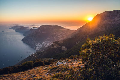 Scenic view of sea against sky during sunset