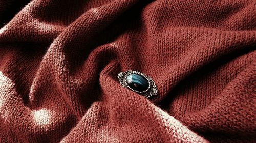 High angle view of ring on fabric