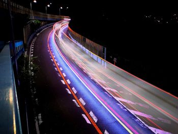 High angle view of light trails on road at night