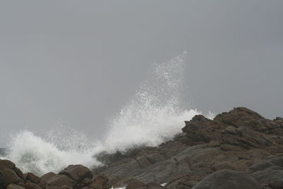 Waves breaking against sea