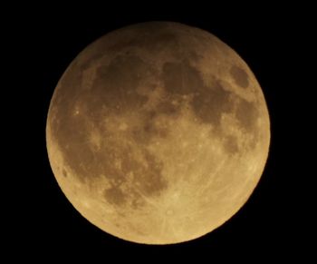 Low angle view of moon against sky at night