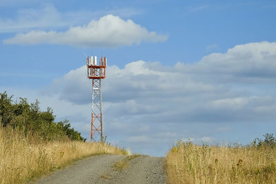 5g radio mast on field against sky