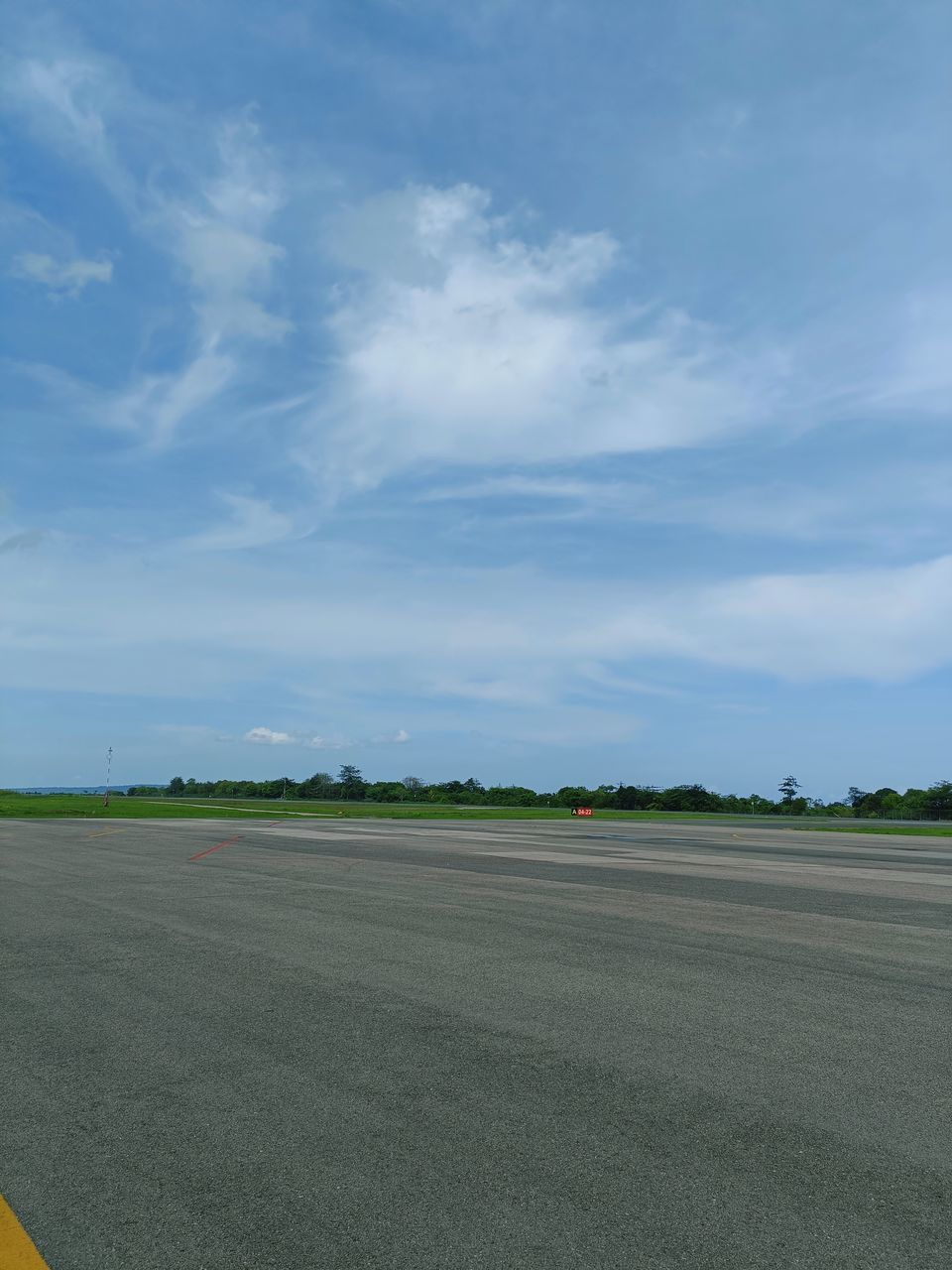 sky, horizon, cloud, transportation, road, plain, environment, nature, field, no people, landscape, day, grass, airport runway, airport, plant, tarmac, asphalt, outdoors, travel, land, green, mode of transportation, highway, scenics - nature