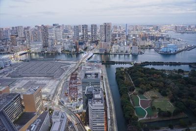 High angle view of river amidst buildings in city