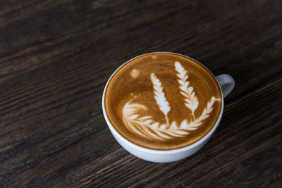 High angle view of cappuccino on table