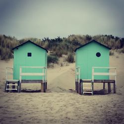 Built structure on beach against sky