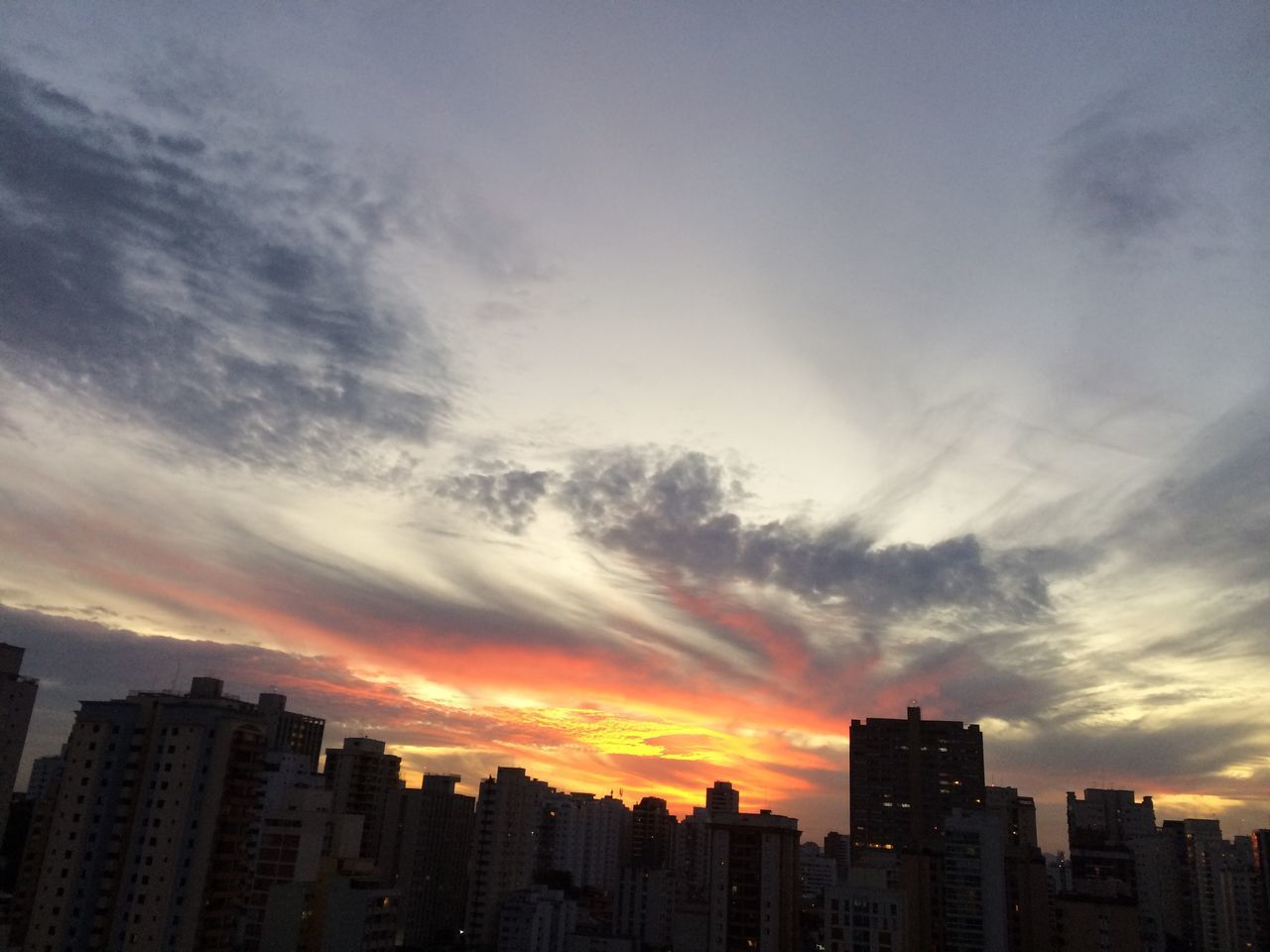 SILHOUETTE BUILDINGS AGAINST SKY AT SUNSET