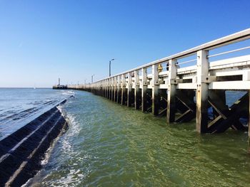 View of sea against clear blue sky