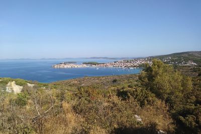 Scenic view of sea against clear blue sky