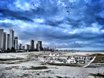 View of beach against cloudy sky